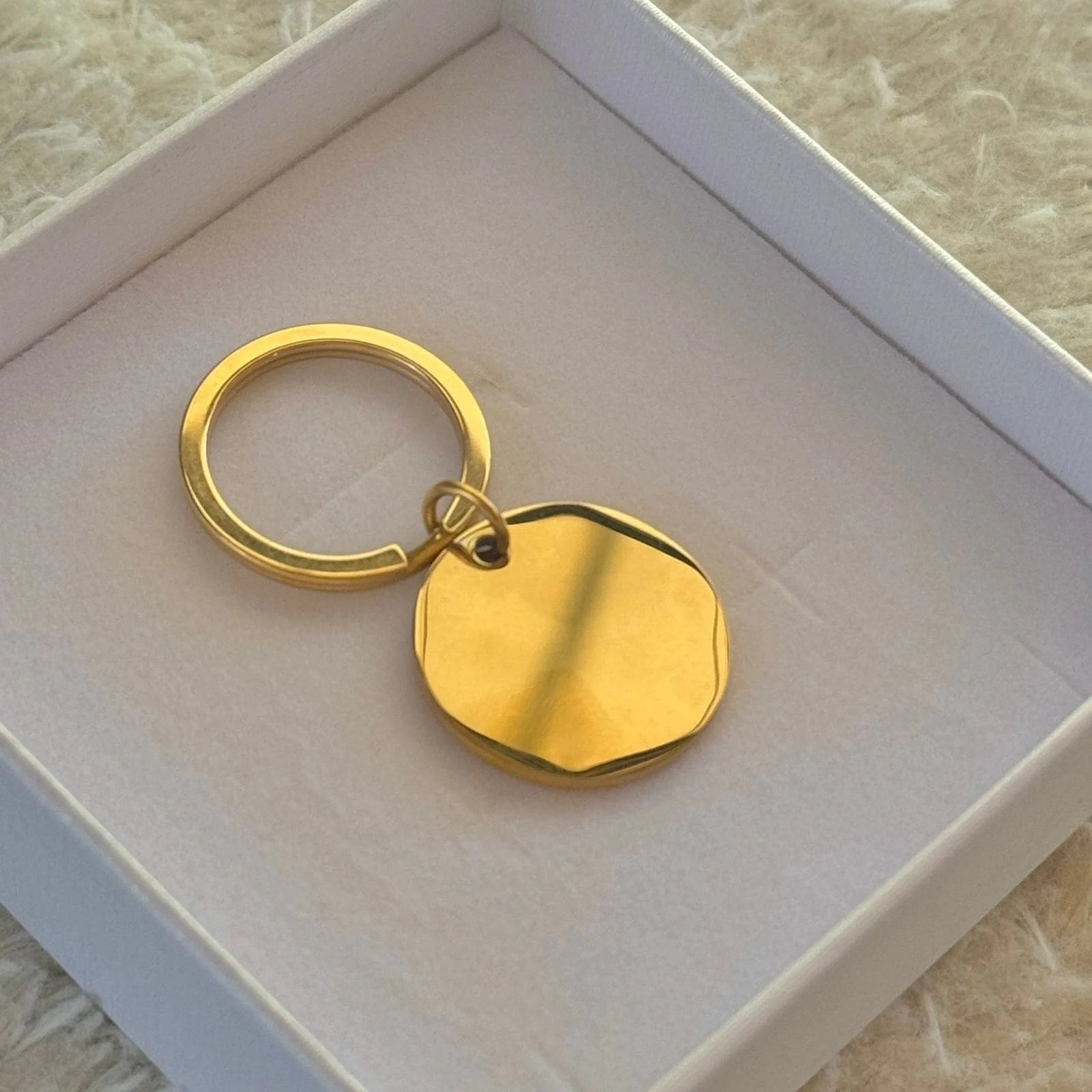 Llavero circular dorado