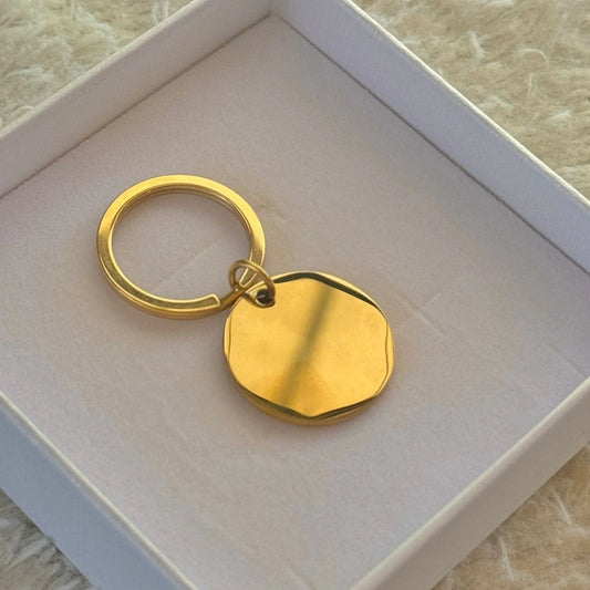 Llavero circular dorado